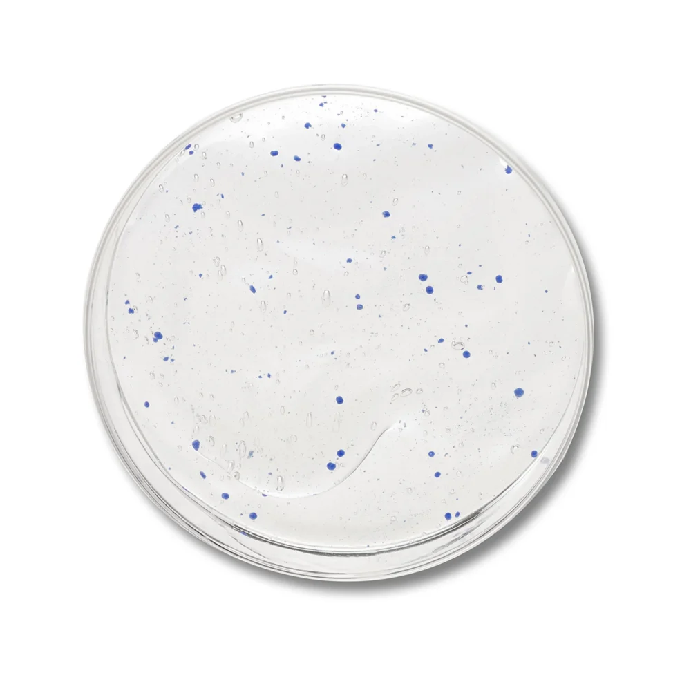 clear serum product swatch with blue specks